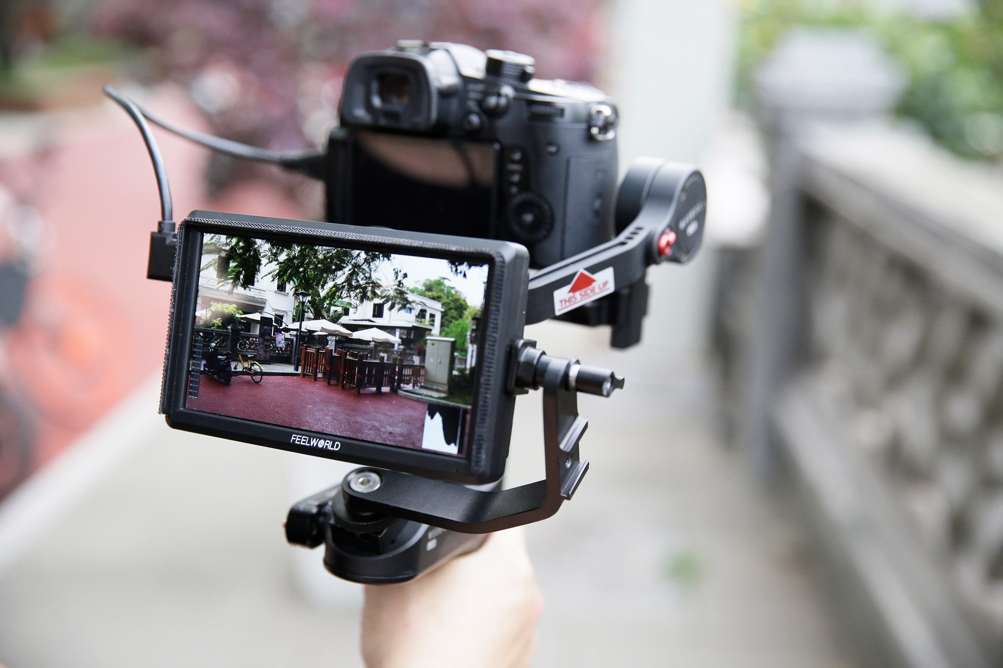 The side-mount with a bracket of FEELWORLD monitor is kinda cool, but most of us are used  to mounting these from the bottom. The supplied bracket lets you tilt the monitor but not rotate. The 5.5 inch screens are great for rigs, crazy angles, cranes, shooting very low or high.🎬🎧 Follow Feelworld